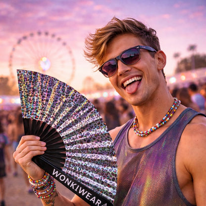 Man holding iridescent leopard rave fan at festival reflective silver fan WonkiWear