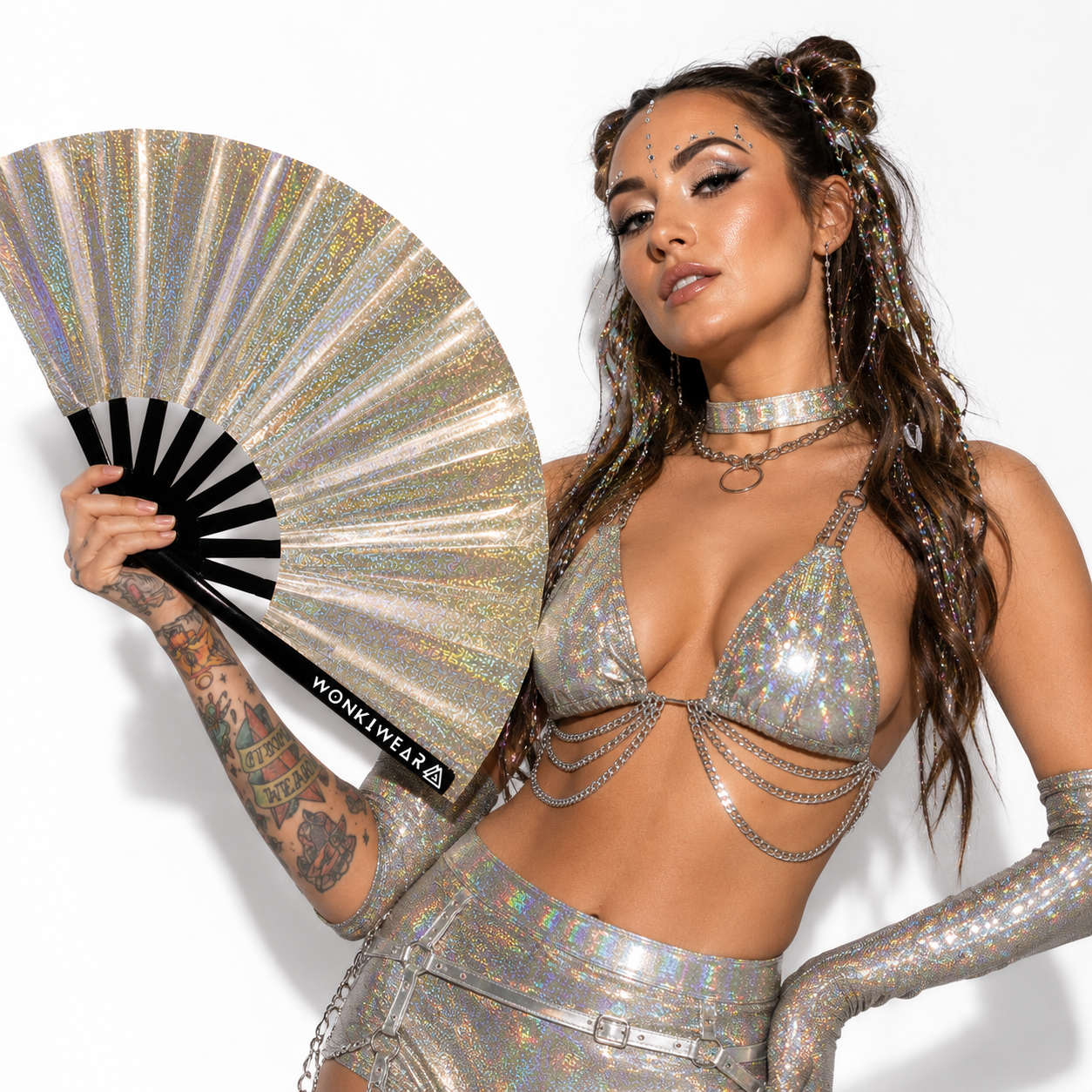 Festival model holding Jupiter Galaxy holographic champagne gold fan in a studio photoshoot 