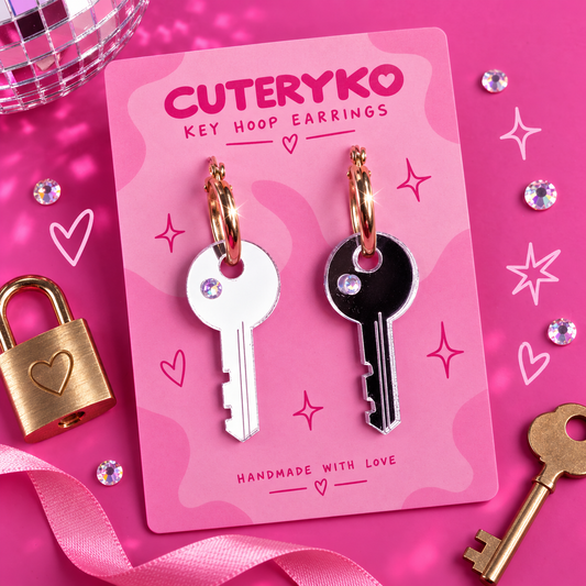 Key hoop earrings with contrasting silver and dark acrylic key charms and iridescent details by Cuteryko