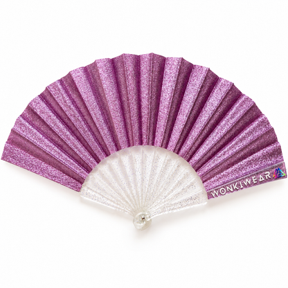 Lilac glitter mini folding fan with clear transparent glitter-speckled ribs and WonkiWear branding on a white background.
