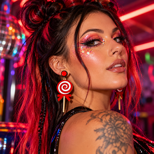 Red and white swirl lollipop earrings worn by a woman with glitter festival makeup at a neon rave