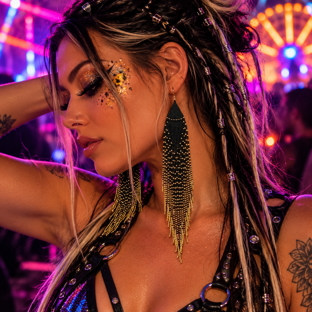 Woman wearing long black and gold beaded feather earrings at a neon rave festival