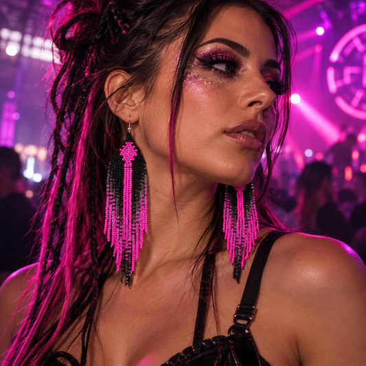 Long pink and black beaded tassel earrings worn by a woman at a neon-lit rave
