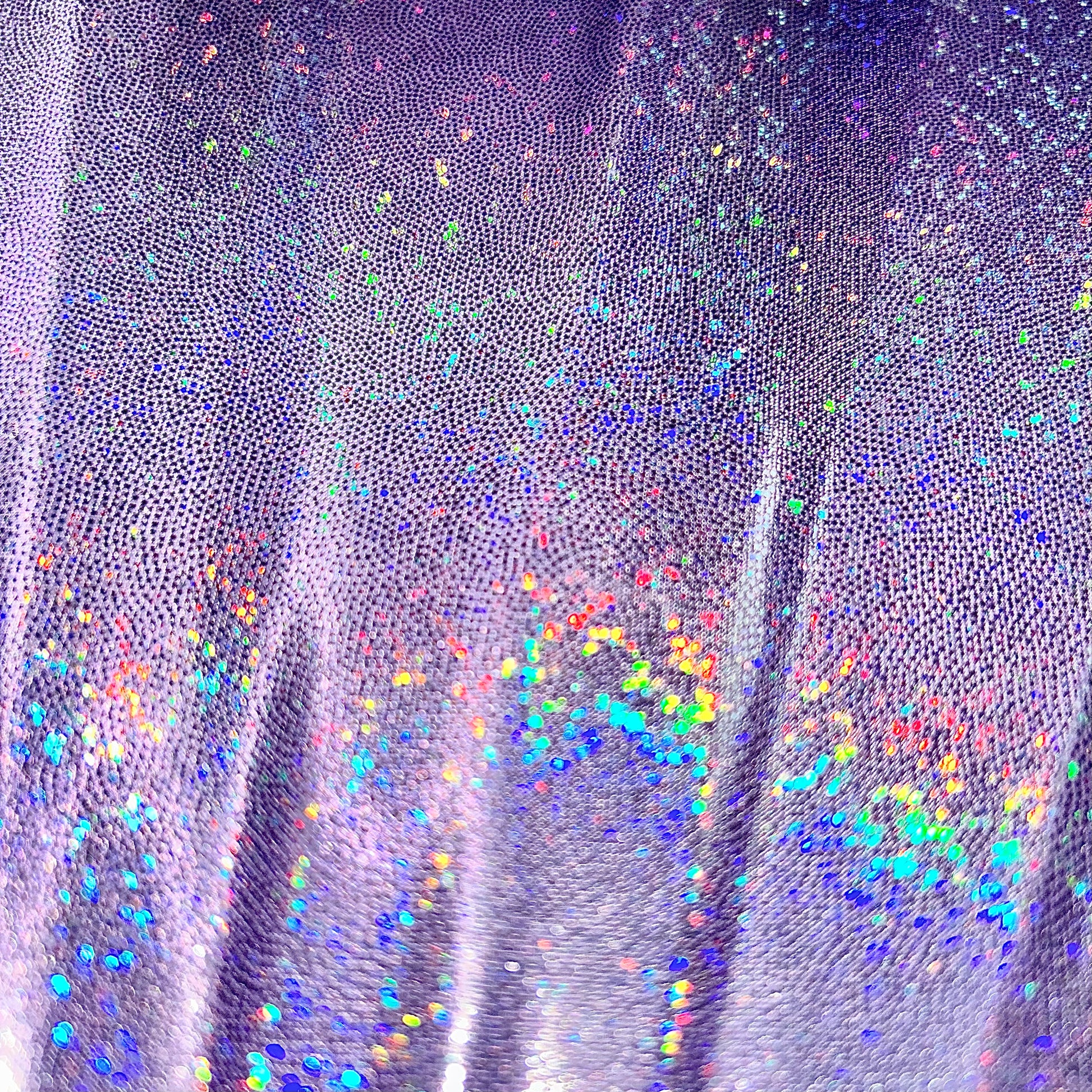 Close-up of Luna Galaxy holographic lilac fabric showing rainbow prism detail