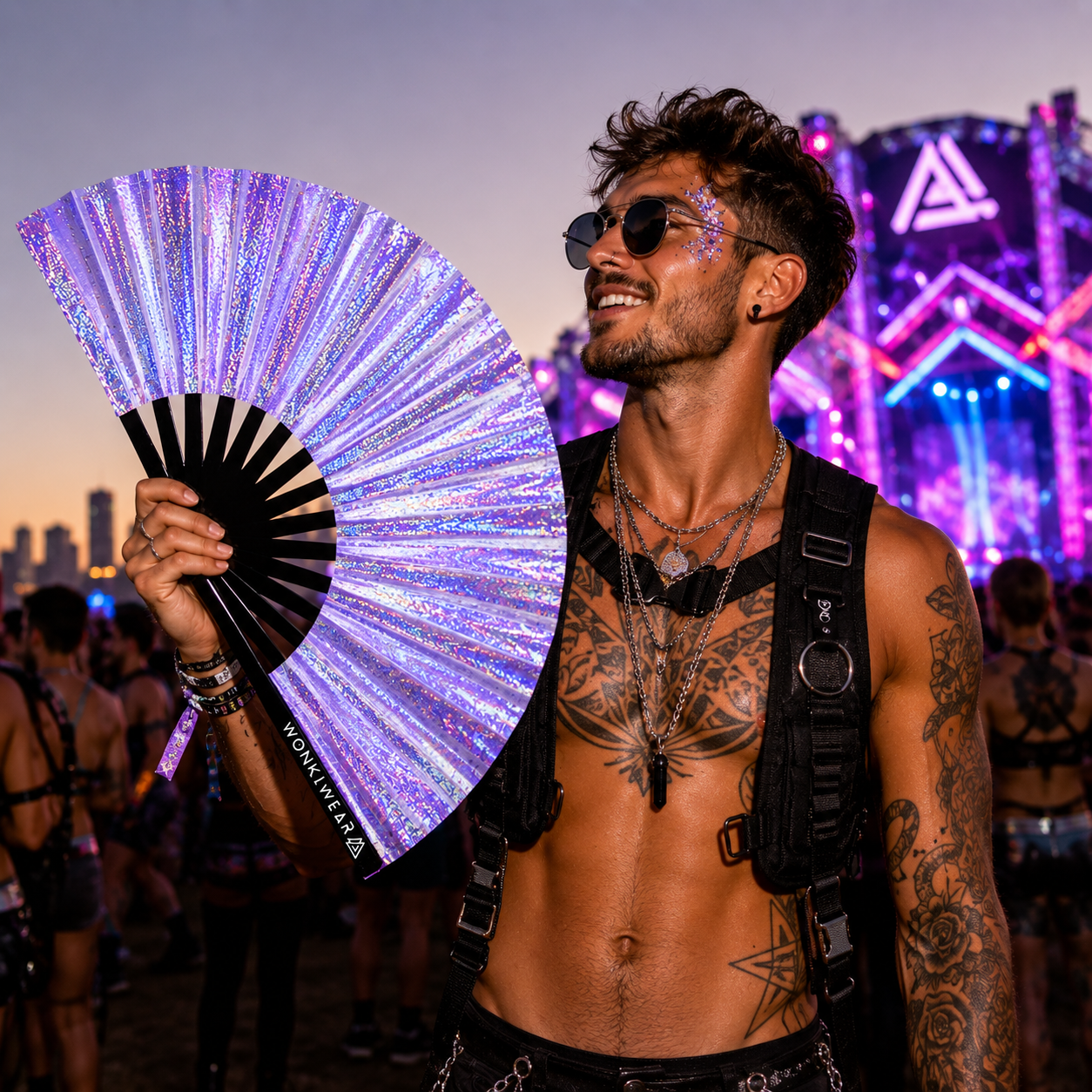 Male festival-goer using Luna Galaxy holographic lilac folding fan