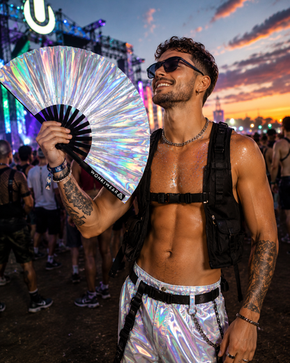 Male festival goer holding Mercury Galaxy metallic silver iridescent XL festival fan