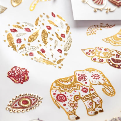 Close up of metallic temporary tattoos in gold silver and pink showing reflective shine