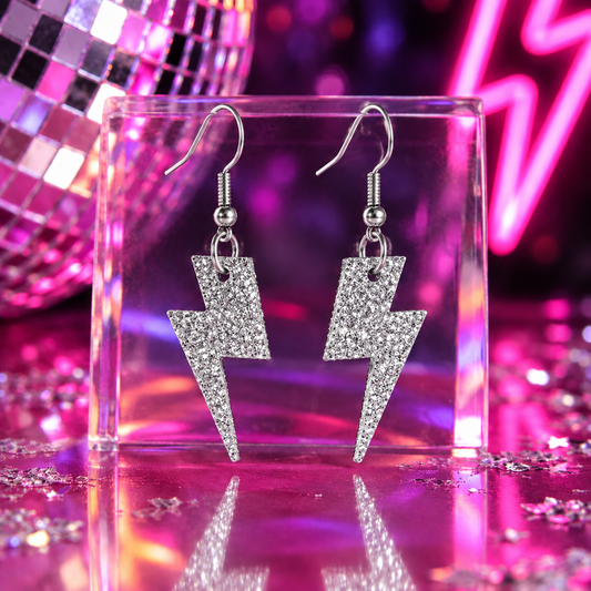 Mini silver glitter lightning bolt earrings with leopard-print cork reverse