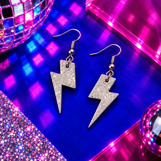 Mini silver glitter cork lightning bolt earrings with stainless steel hooks by Trend Tonic