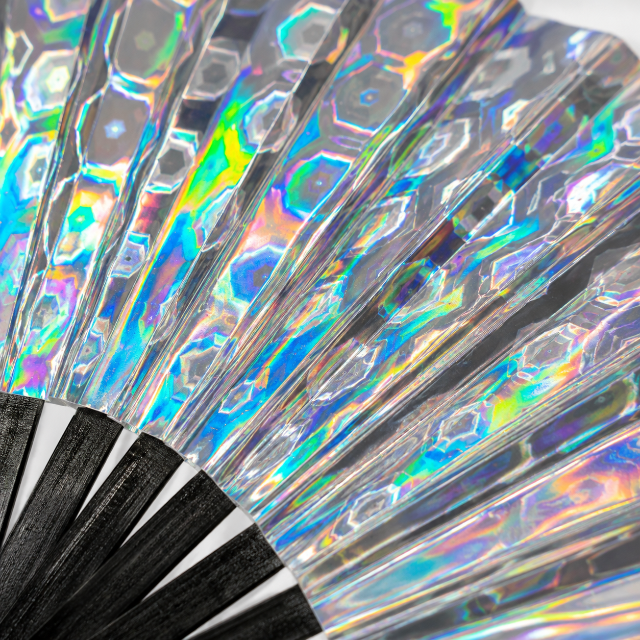 Close-up of Mirror Maze holographic festival fan showing rainbow prism reflections
