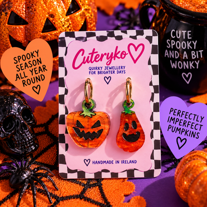 Misshapen Spooky Pumpkin hoop earrings with mismatched glittery orange pumpkin charms by Cuteryko