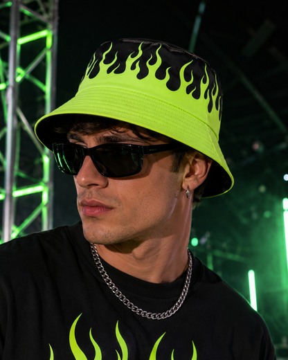 Male model wearing neon green flame bucket hat at rave