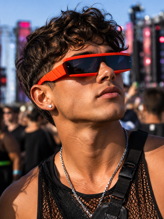 Male festival model wearing neon orange futuristic rave glasses