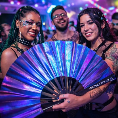 Festival attendees using Neptune Galaxy iridescent fan at music festival