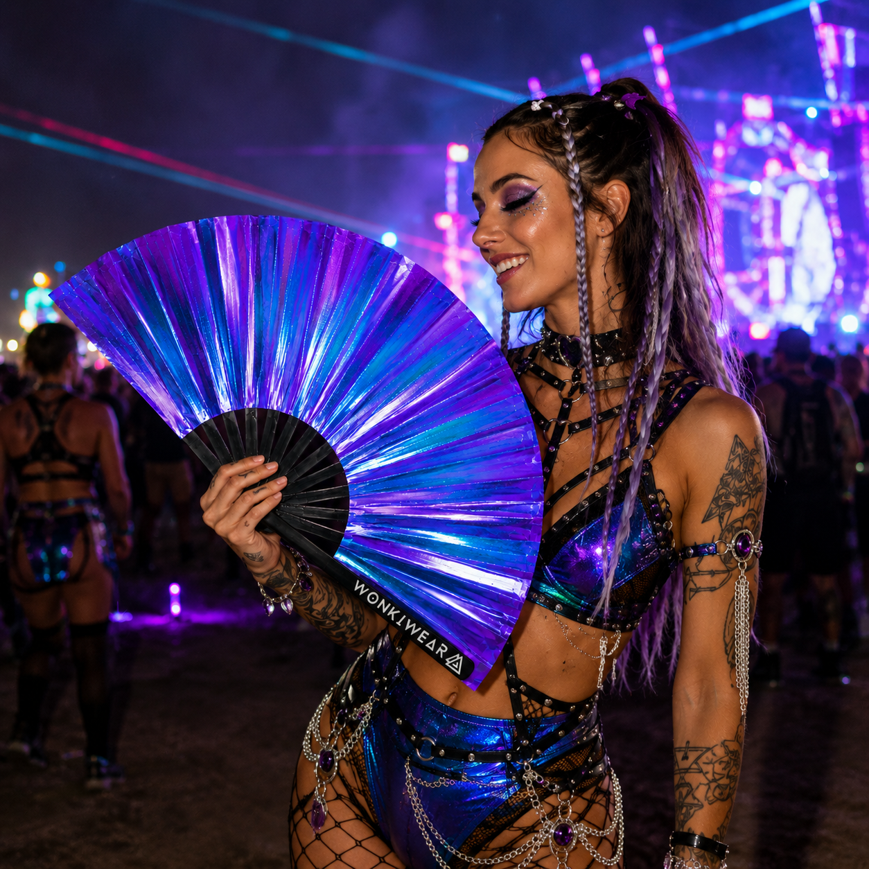 Festival attendee using Neptune Galaxy iridescent fan at music festival