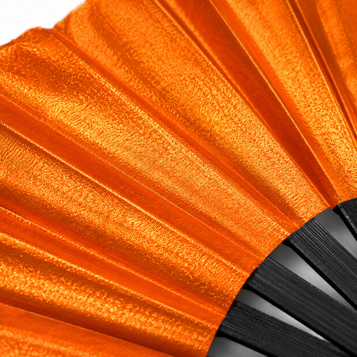 Close-up showing metallic orange shimmer texture on WonkiWear XL festival fan