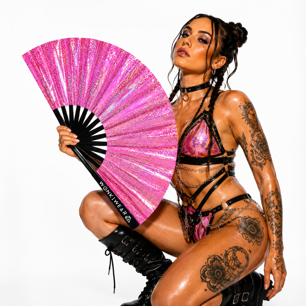 Festival model holding Orion Galaxy holographic pink XL hand fan in studio photoshoot