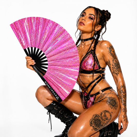 Festival model holding Orion Galaxy holographic pink XL hand fan in studio photoshoot