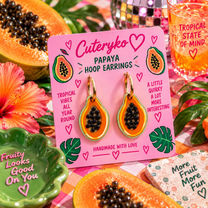Papaya hoop earrings with vibrant orange fruit slice charms and black seed details by Cuteryko