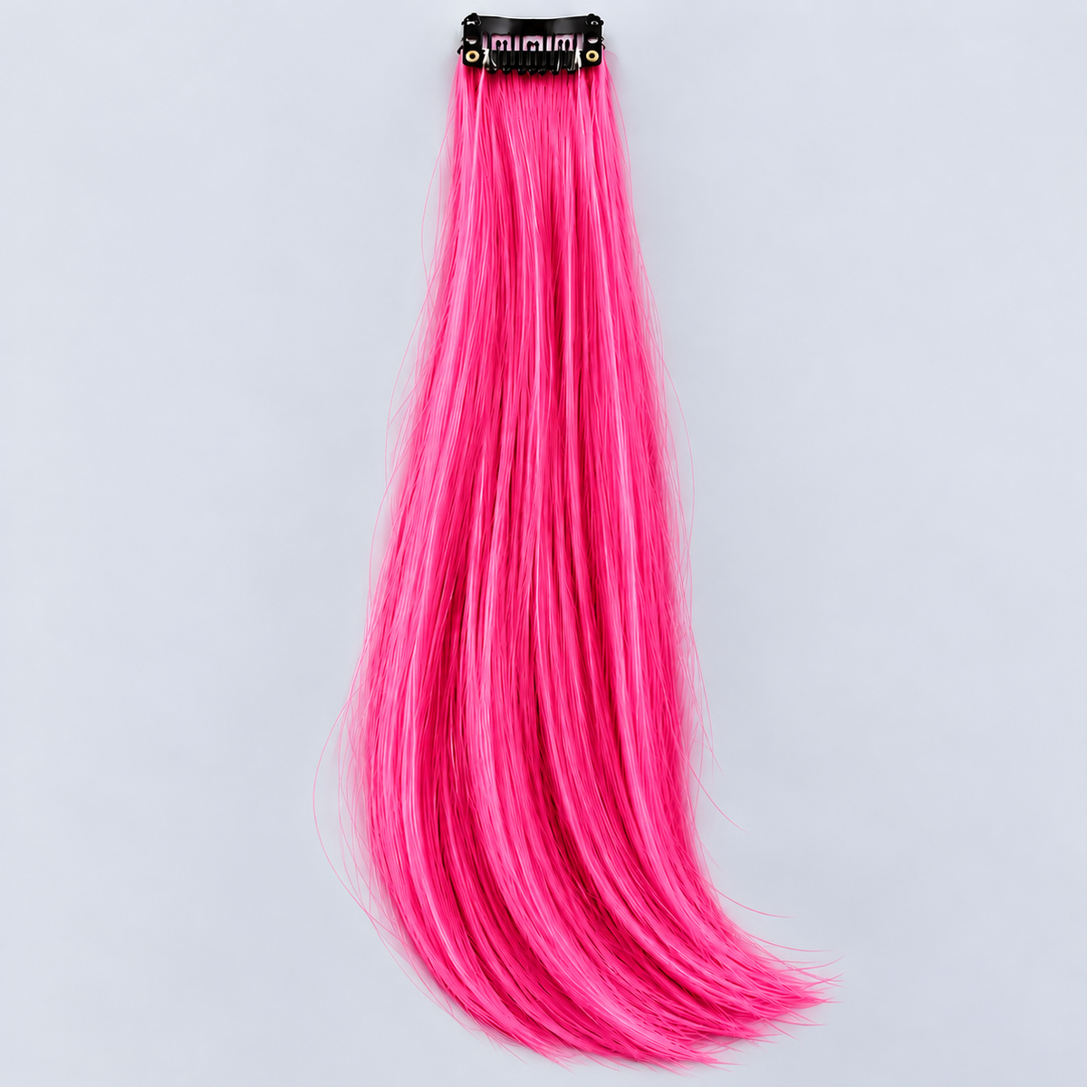 Hot pink clip-in hair extension with long, silky bright-pink strands and a black attachment clip.