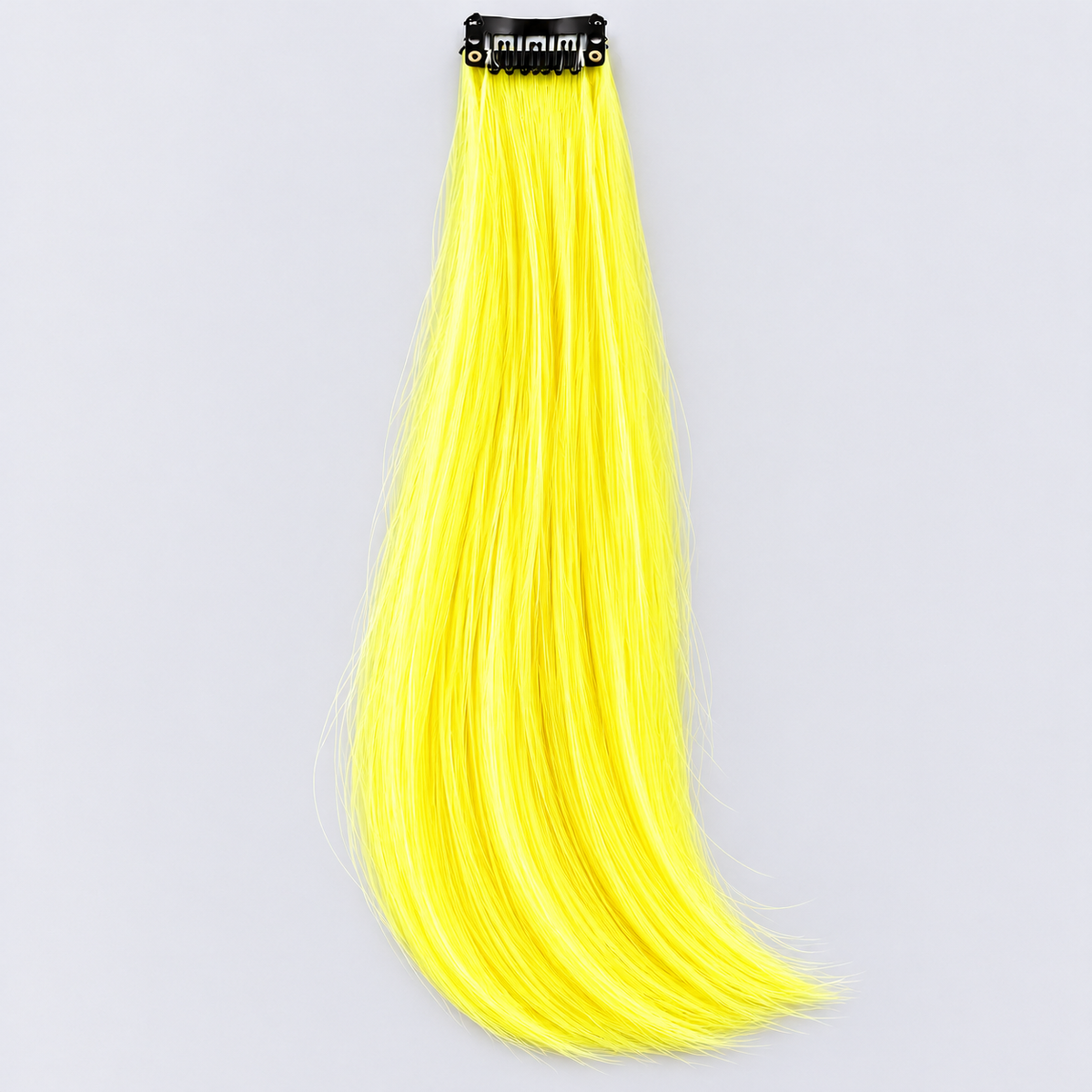 Yellow clip-in hair extension with long, silky neon-yellow strands and a black attachment clip.