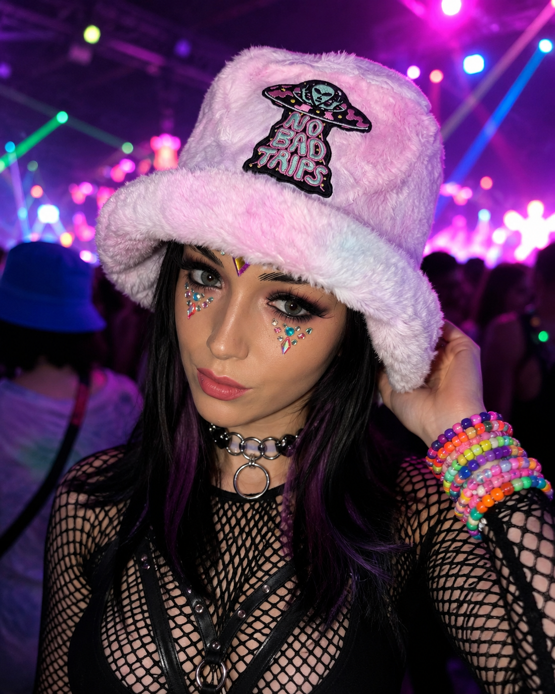 Female festival model wearing pastel pink No Bad Trips furry bucket hat