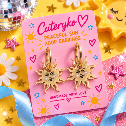 Peaceful Sun hoop earrings with smiling sunburst charms and gold hoops by Cuteryko