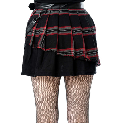 Close-up of the Poizen Industries Phantom Highlander skirt's black and red tartan pleats and layered panels.