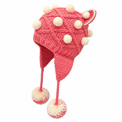 Side view of handmade pink knitted festival hat with cat ears and pom poms