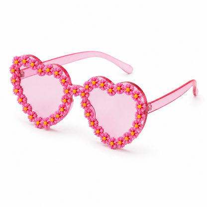 Angled view of pink heart shaped daisy sunglasses