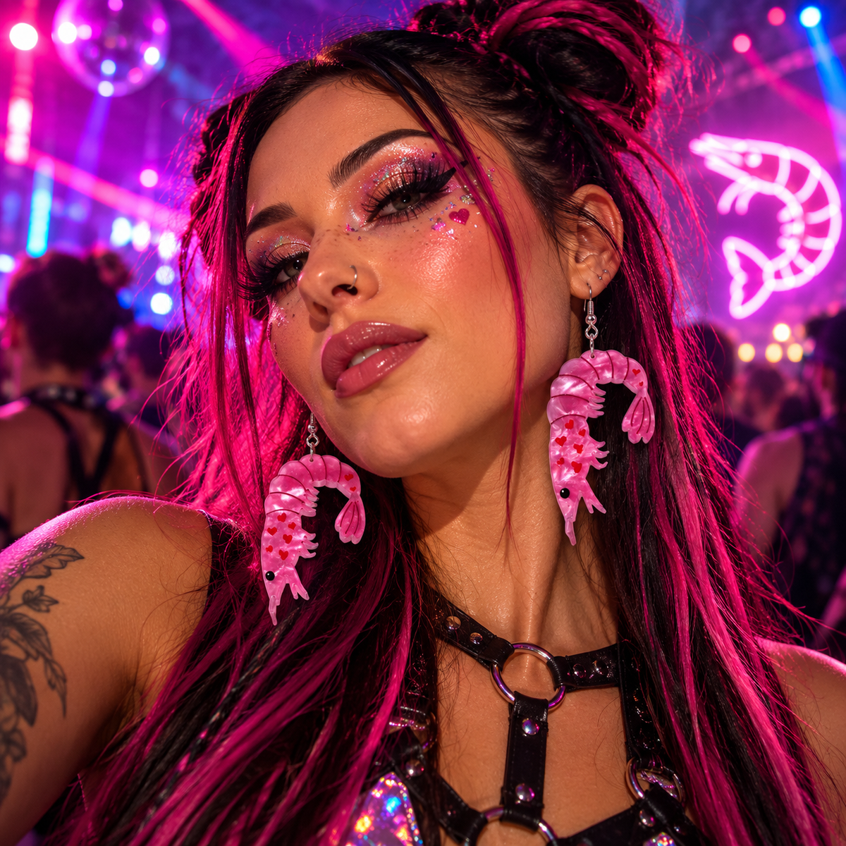 Woman wearing pink prawn shrimp statement earrings at a vibrant neon rave