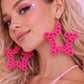 Statement pink star earrings UK playful design
