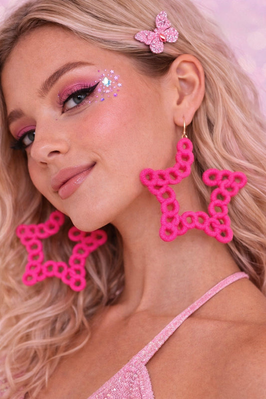 Statement pink star earrings UK playful design