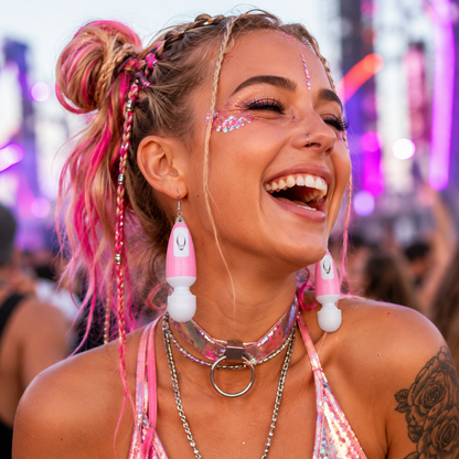 Festival model wearing pink mini vibrating novelty earrings