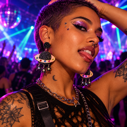 Woman wearing colourful Saturn planet statement earrings with star charms at a neon rave