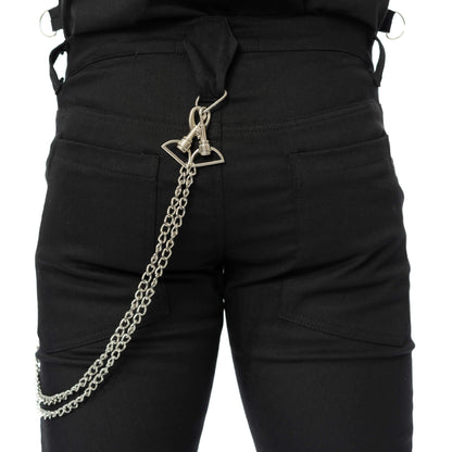 Rear close-up of black alternative trousers showing the decorative metal chain