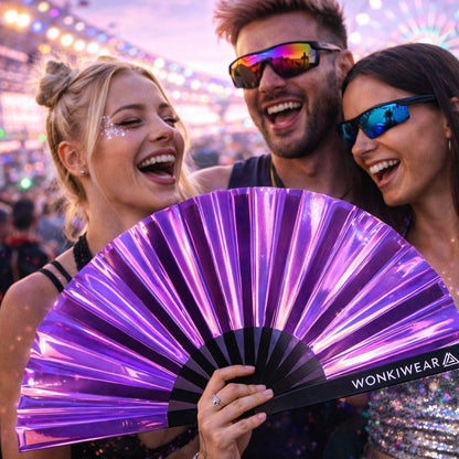 Group of friends at festival holding purple iridescent rave fan by WonkiWear