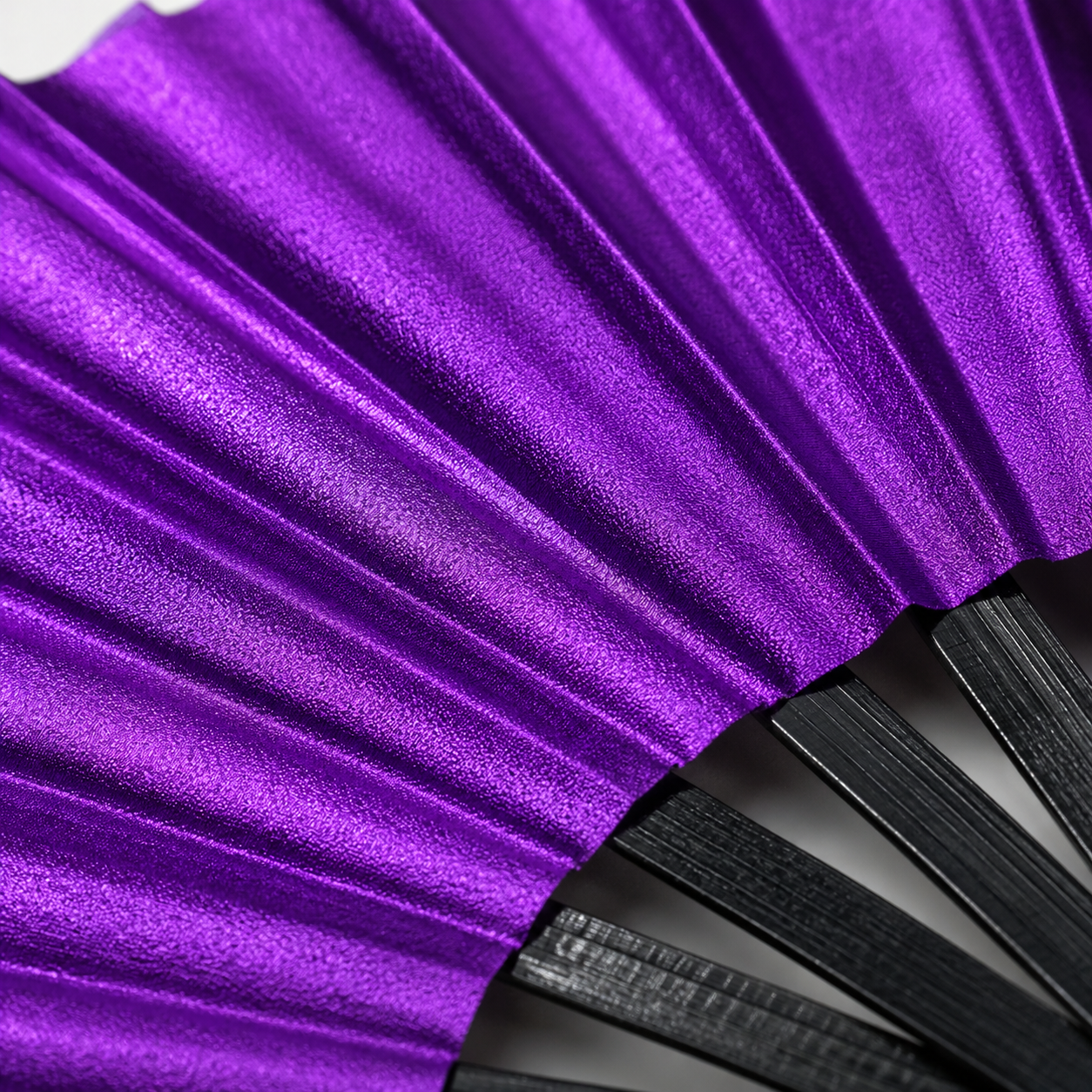 Close-up showing metallic purple shimmer texture on WonkiWear XL festival fan