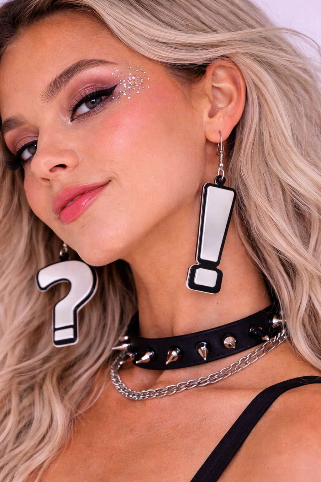 Model wearing question mark earrings alternative styling UK