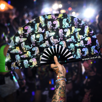 Rainbow reflective tiger rave fan glowing brightly at night festival under camera flash