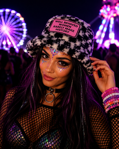Rave model wearing black and white furry bucket hat with Well Behaved Women Rarely Make History patch