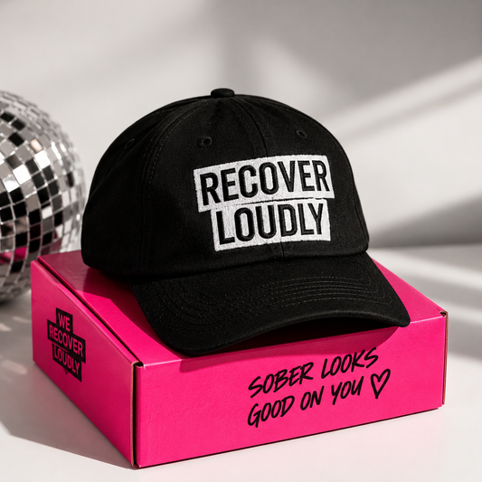 Black Recover Loudly cap with white embroidered statement design