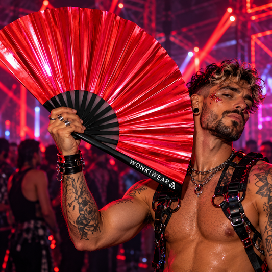 Red iridescent festival fan held by a male rave-goer at a vibrant nightclub