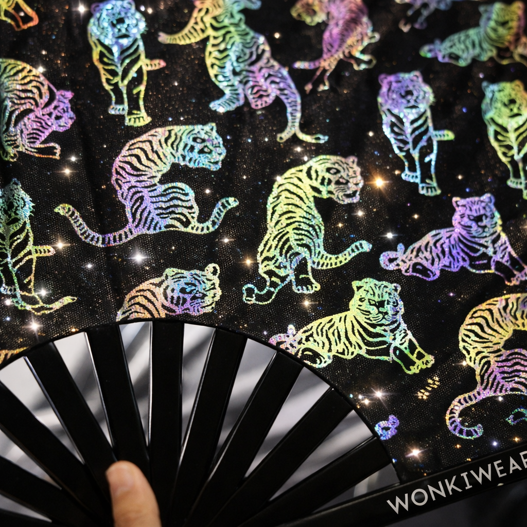 Close-up detail of rainbow reflective tiger print on black XL rave fan with bamboo ribs