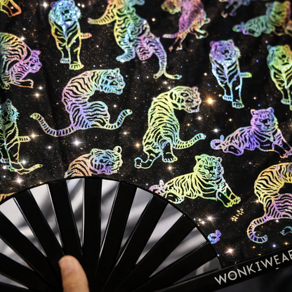 Close-up detail of rainbow reflective tiger print on black XL rave fan with bamboo ribs
