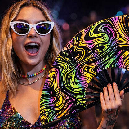WonkiWear reflective swirl rave fan glowing under festival and concert lighting With woman