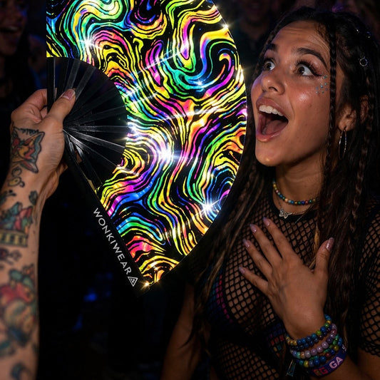 WonkiWear reflective swirl rave fan glowing under festival and concert lighting