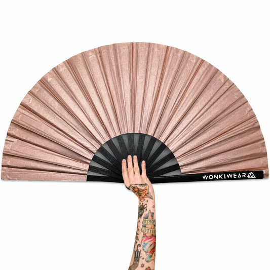 XL rose gold shimmer festival fan with black bamboo ribs and WonkiWear logo