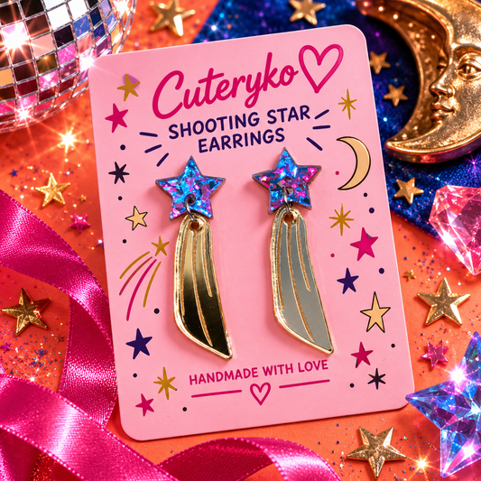 Shooting Star earrings with iridescent blue pink star studs and metallic gold tails by Cuteryko