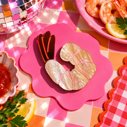Shrimp hair clip featuring a shimmery peeled prawn design by Cuteryko